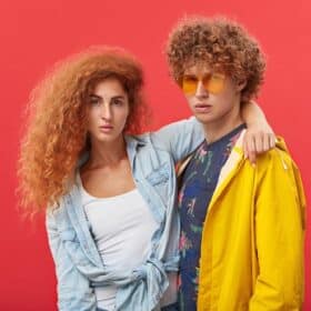 Smiling couple with ginger hair embracing